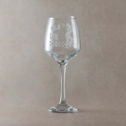 Wine glass with Walt Jabsco engraving and SKA'd for Life text, on a pale background