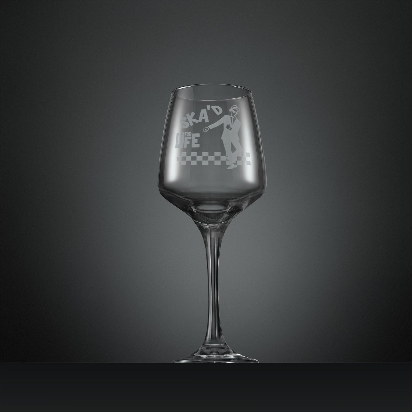 Engraved wine glass featuring a dancing SKA man on a checkerboard floor with inscription