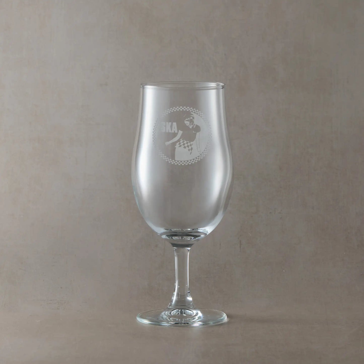 Stemmed beer pint glass engraved with SKA, an original rude girl design and checkerboard border