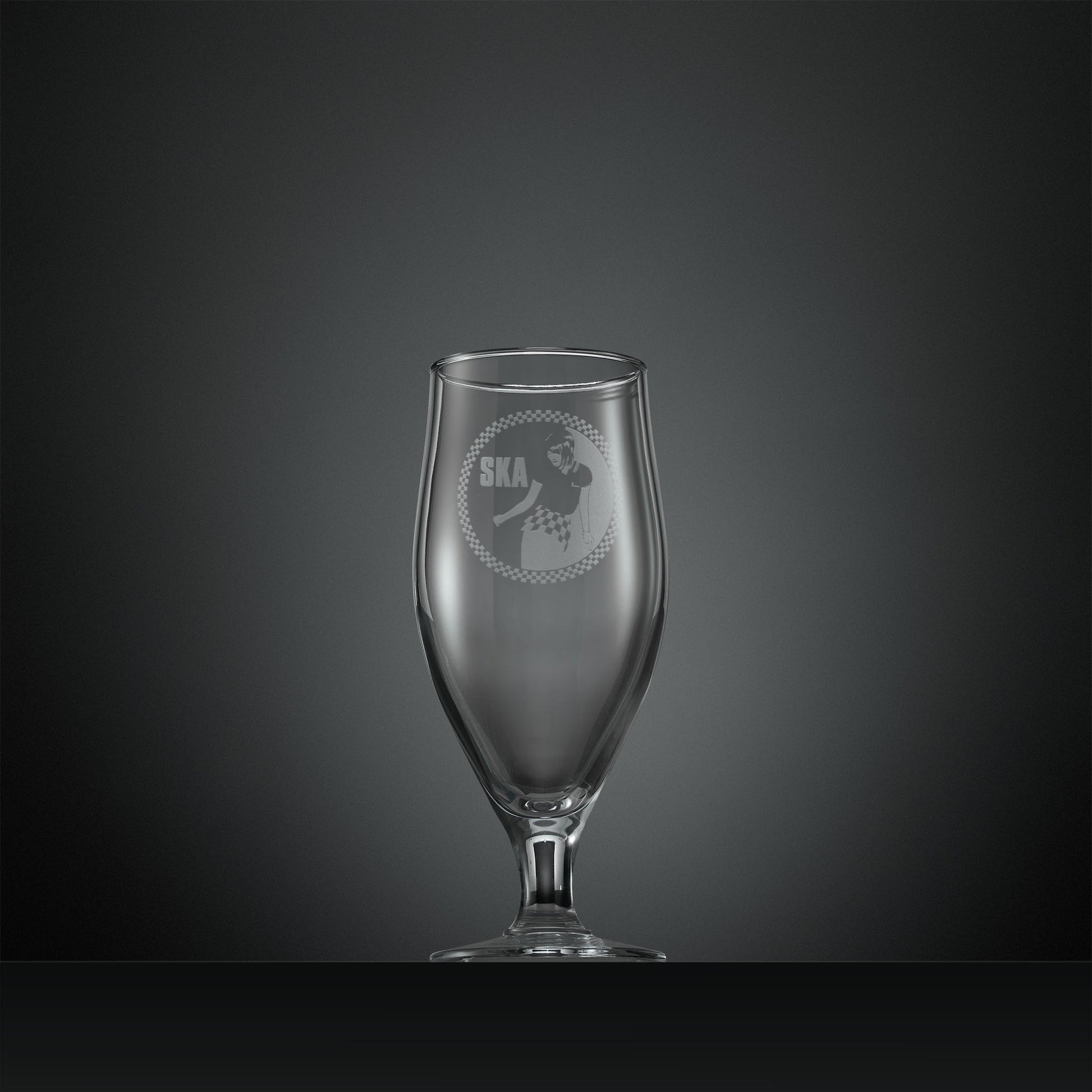 Engraved stemmed beer glass with Ska rude girl facing left and checkerboard design