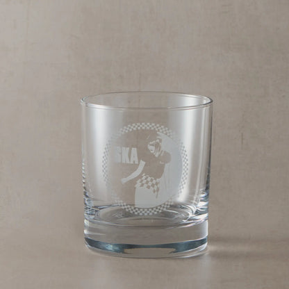 Whisky glass engraved with a Rude Girl in checkerboard skirt and Ska text – circular design with border in 2 Tone style