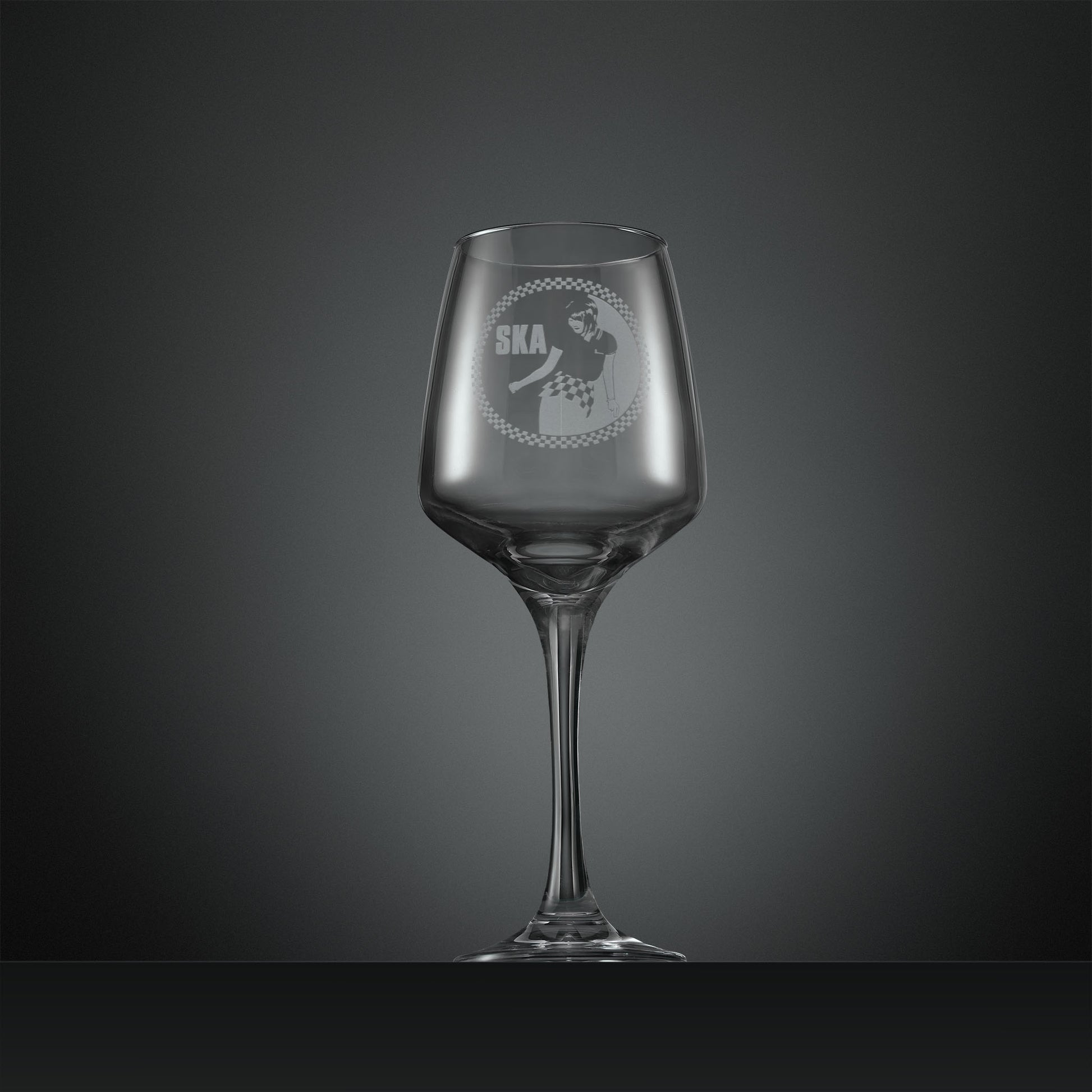 Engraved wine glass with Ska rude girl facing left and checkerboard design