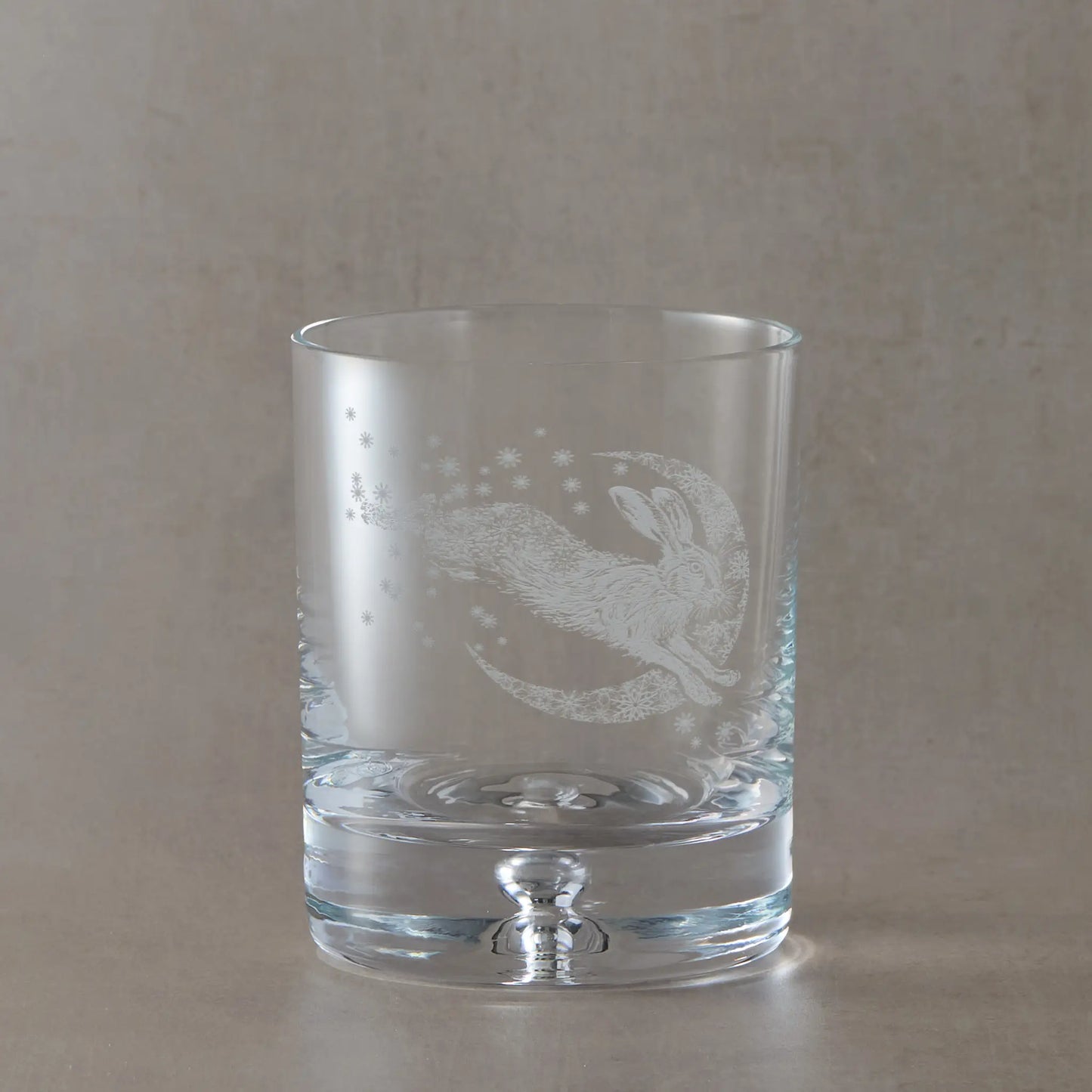 Winter snowflakes whisky glass with engraved leaping hare and crescent moon