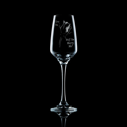 will you marry me and single rose engraved champagne flute on a black background