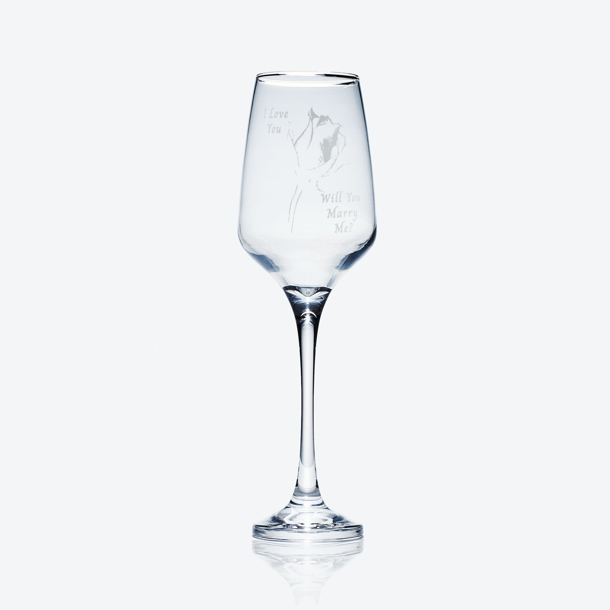 marriage proposal and single rose engraved champagne flute on a white background