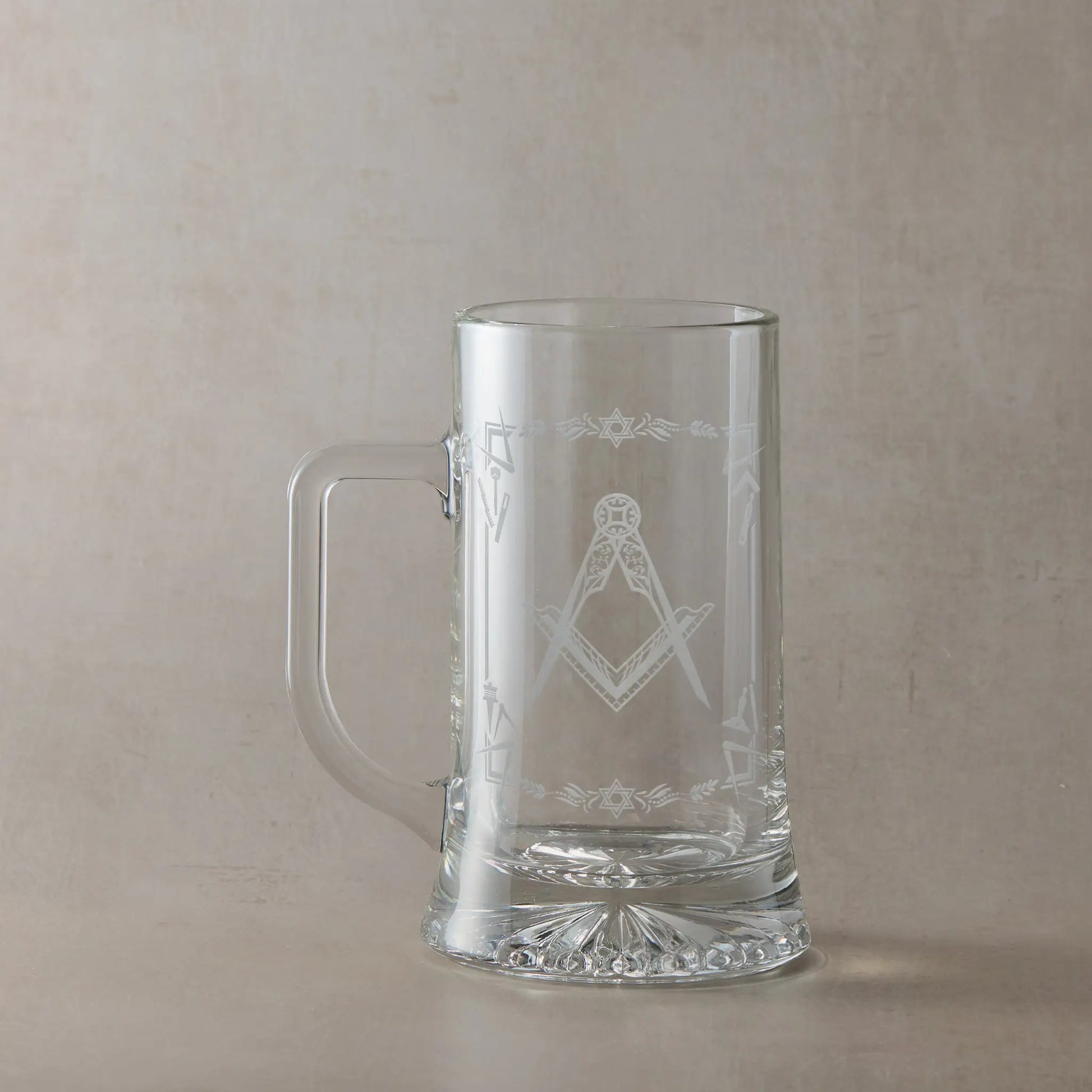 Masonic  tankard with Square & Compass and lodge details, displayed on beige background, handle to the left of design