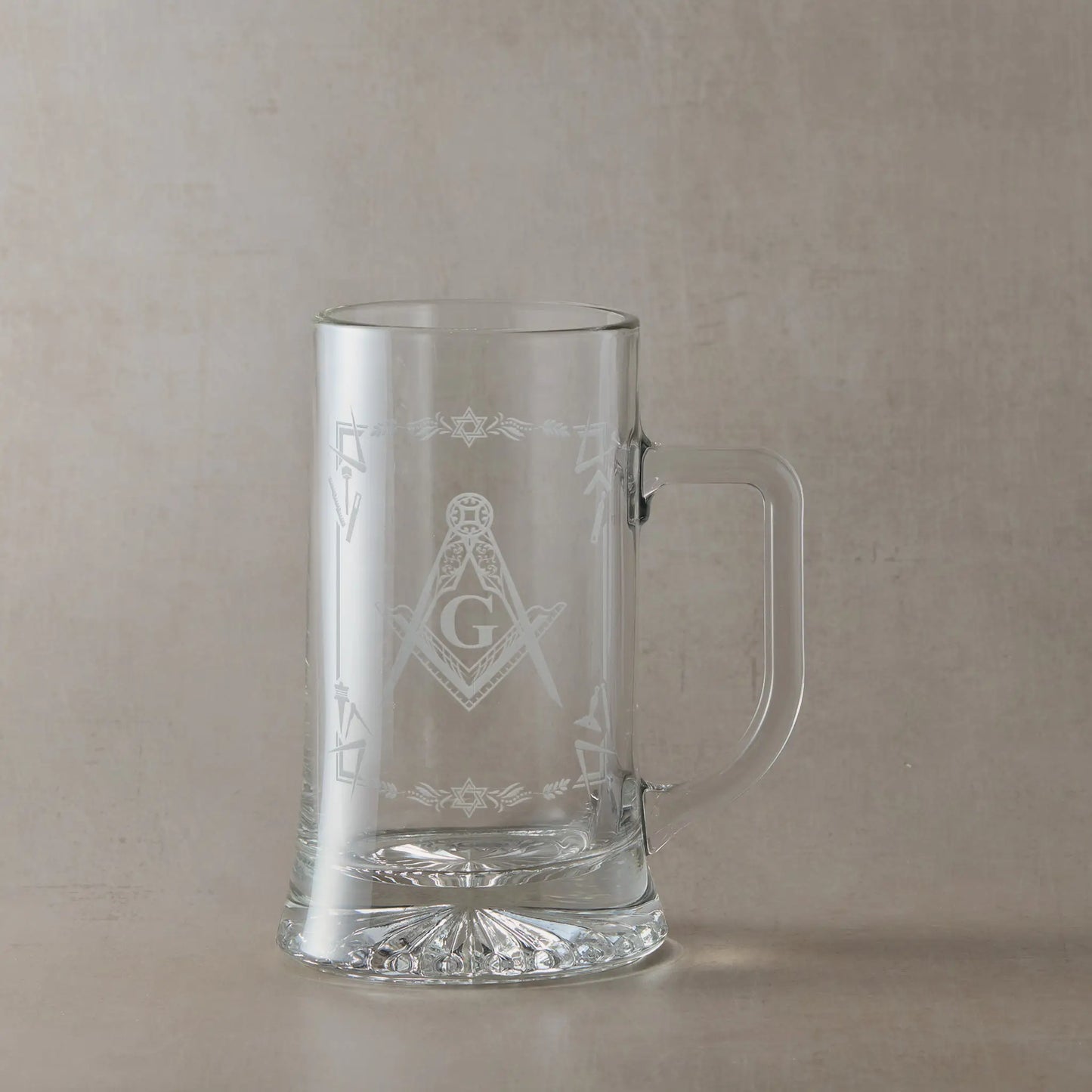 Masonic  tankard with Square & Compass and lodge details, displayed on beige background, handle to the right of design