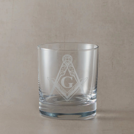 Whisky glass engraved with a detailed masonic square and compass with the letter G in the centre