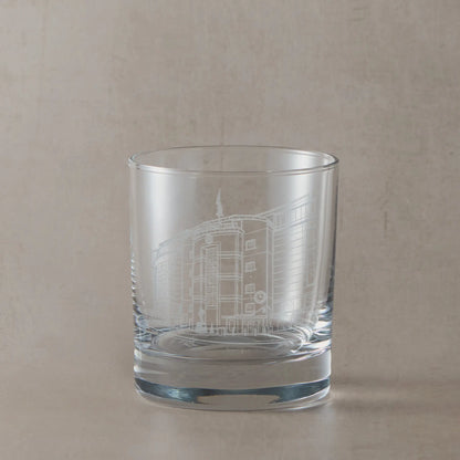 Engraved whisky glass with Stamford Bridge Stadium, shown on a beige background