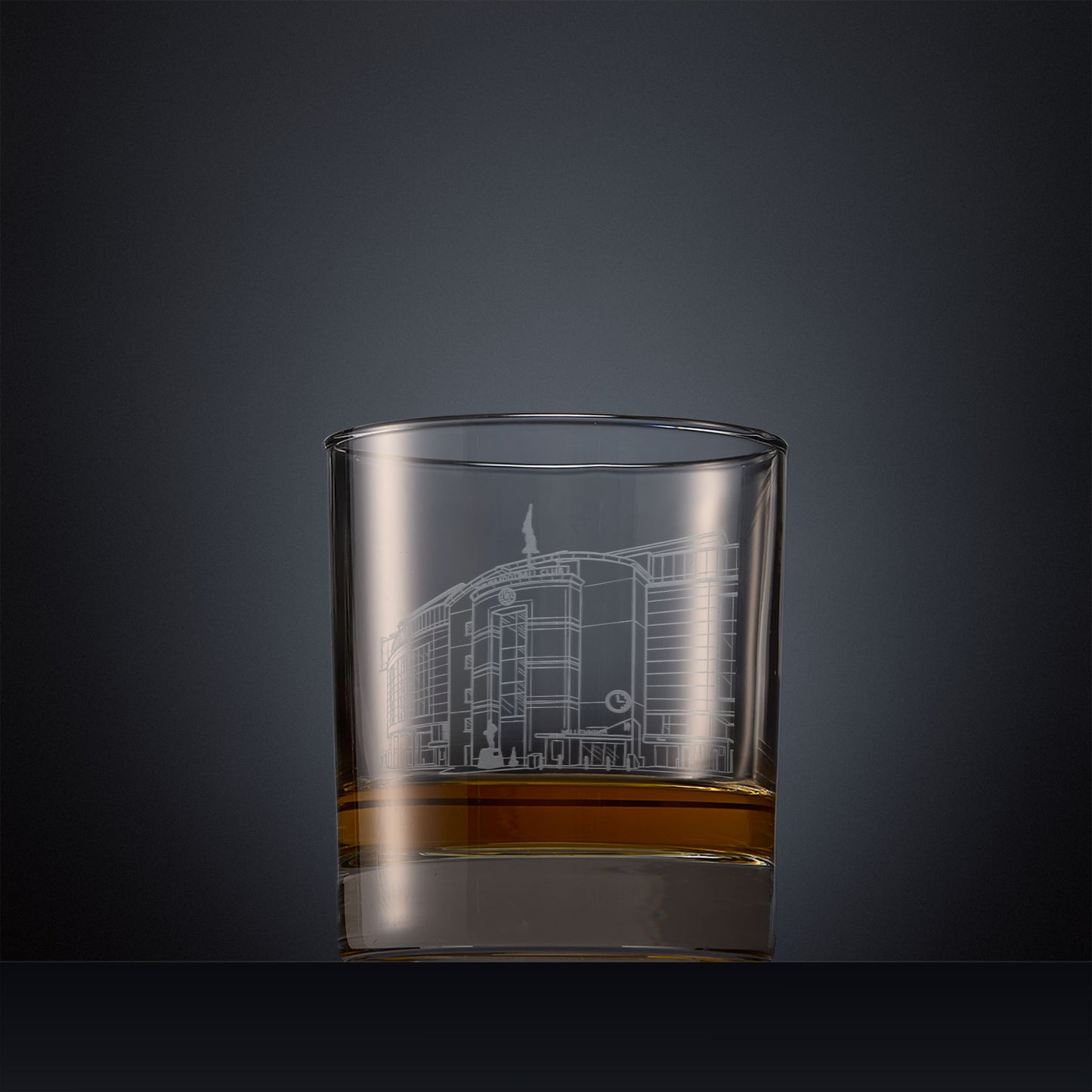 Whisky glass with engraved Stamford Bridge Stadium design and space for personalised text.