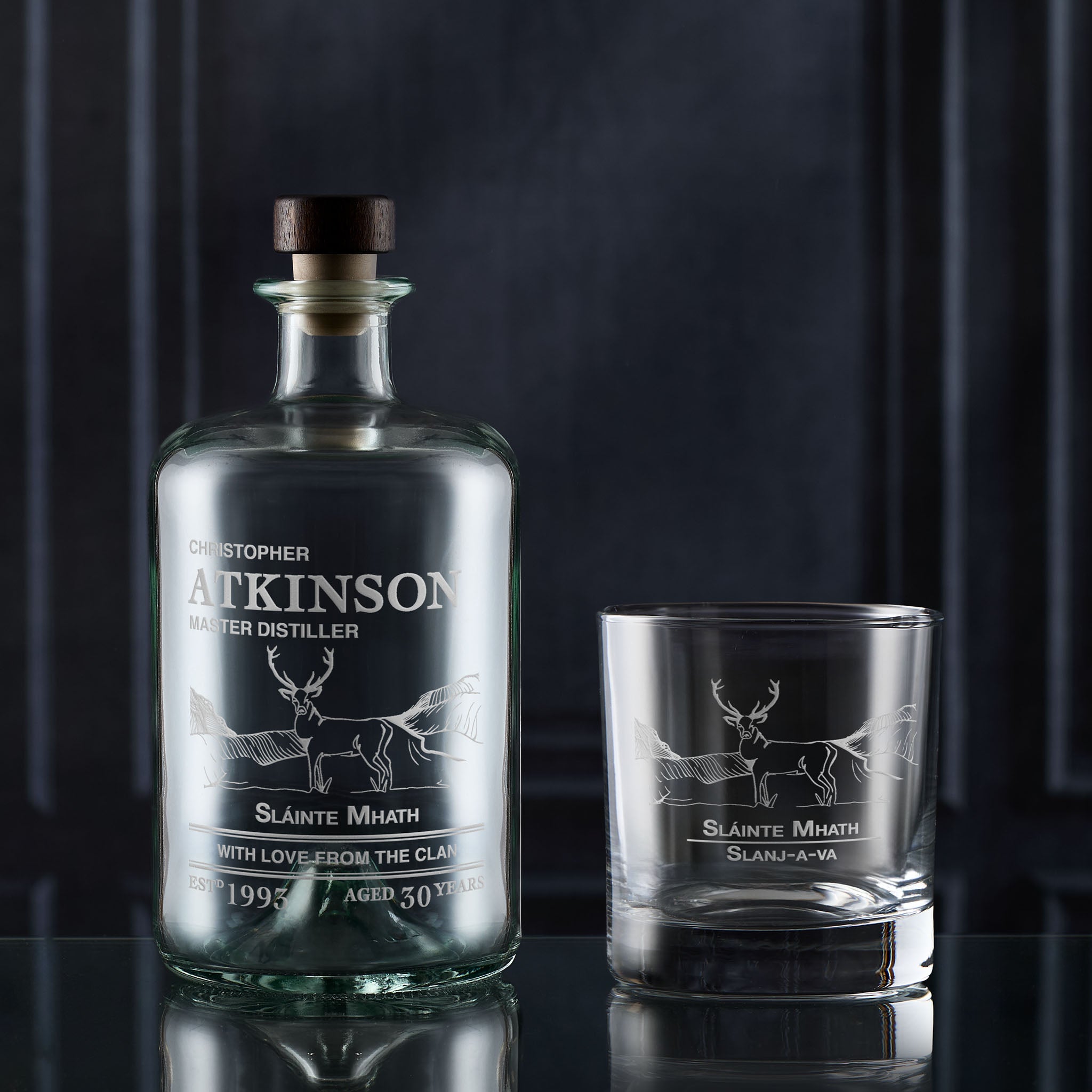 Whisky Decanter gift set featuring an engraved stag design and personal text on a dark background