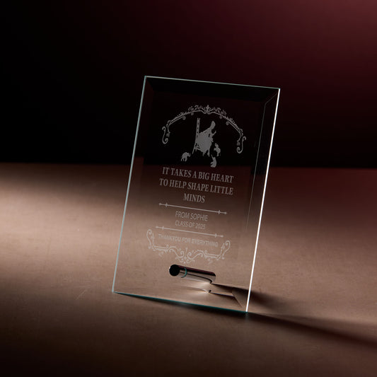 Teacher appreciation glass plaque with engraved text on a dark background