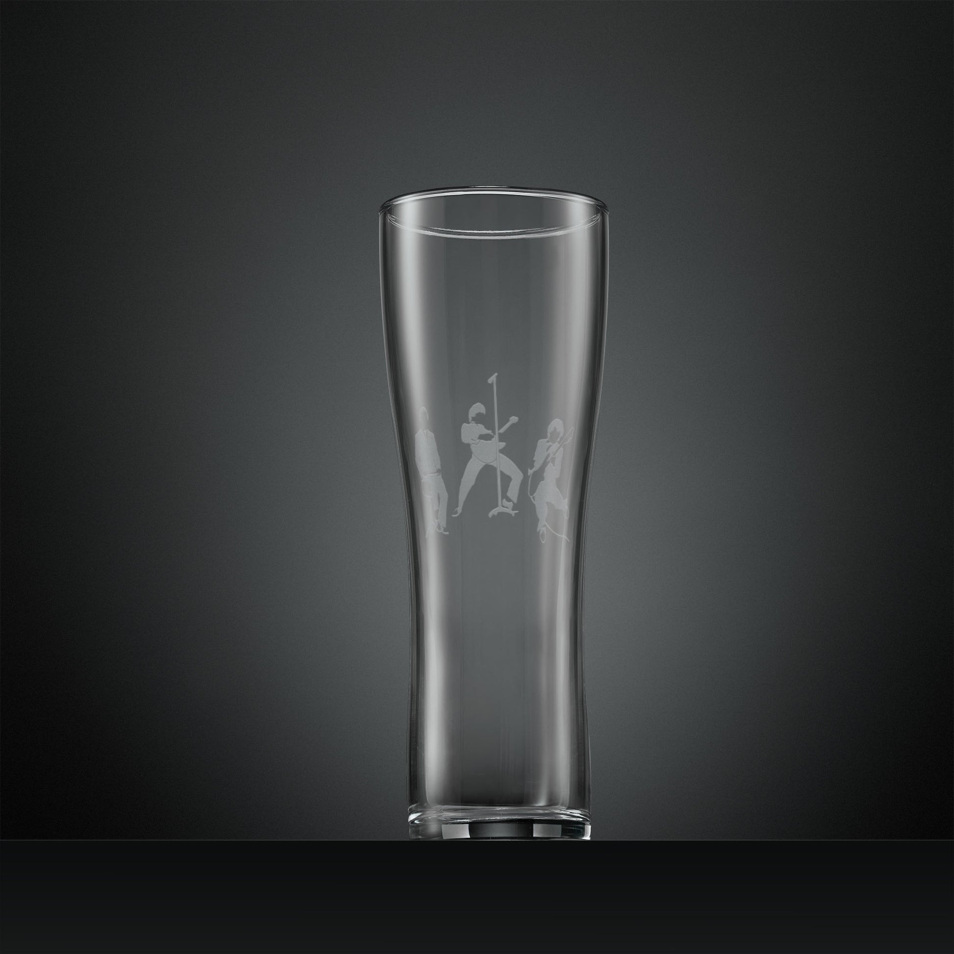 Engraved pint glass with silhouette of The Jam band members