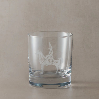 Engraved whisky glass featuring the Duke of Wellington statue in Glasgow with its iconic traffic cone, shown on a neutral studio background