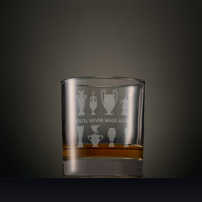 Engraved whisky glass featuring a Liverbird on a trophy, with seven other trophy silhouettes