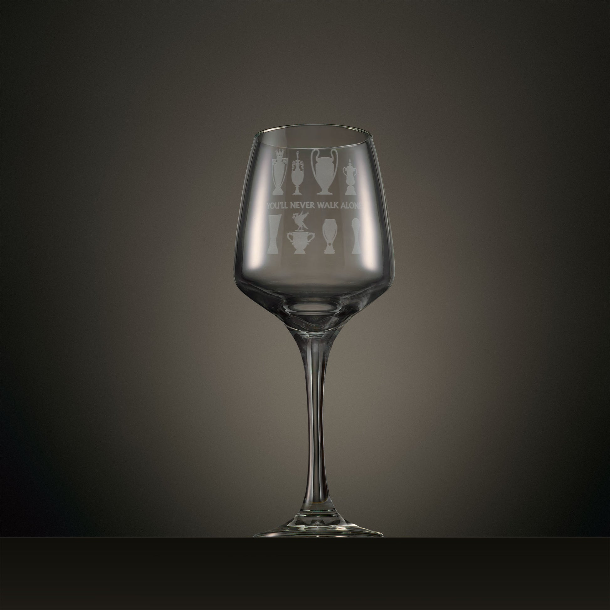 Engraved wine glass featuring eight trophy silhouettes and Liverbird motif, personalised with your chosen name, date or message