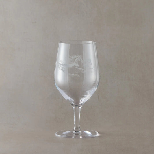 Mineral water glass engraved with two unicorns, shown on a pale background