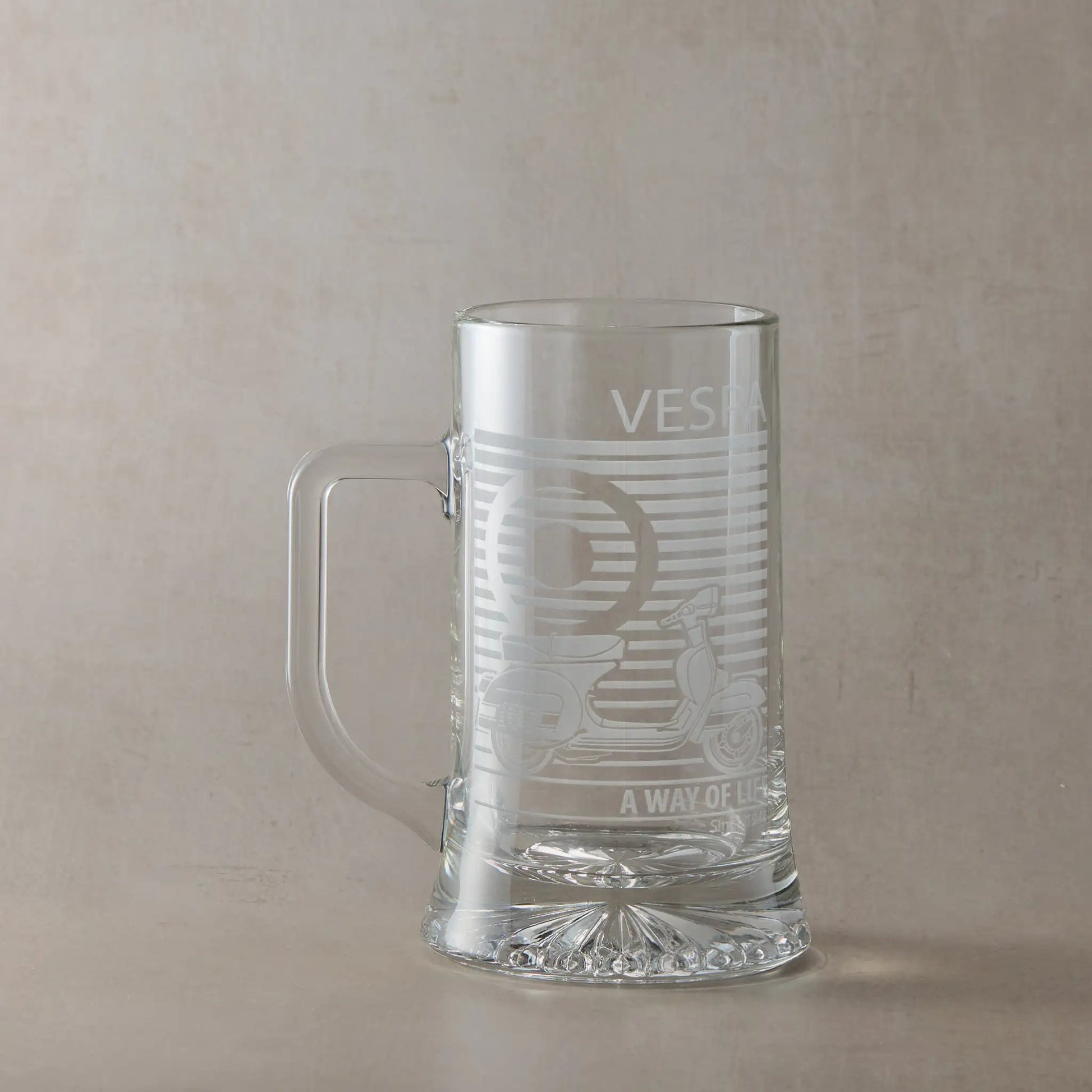 Vespa 200 scooter engraved tankard with handle left photographed on neutral beige background.