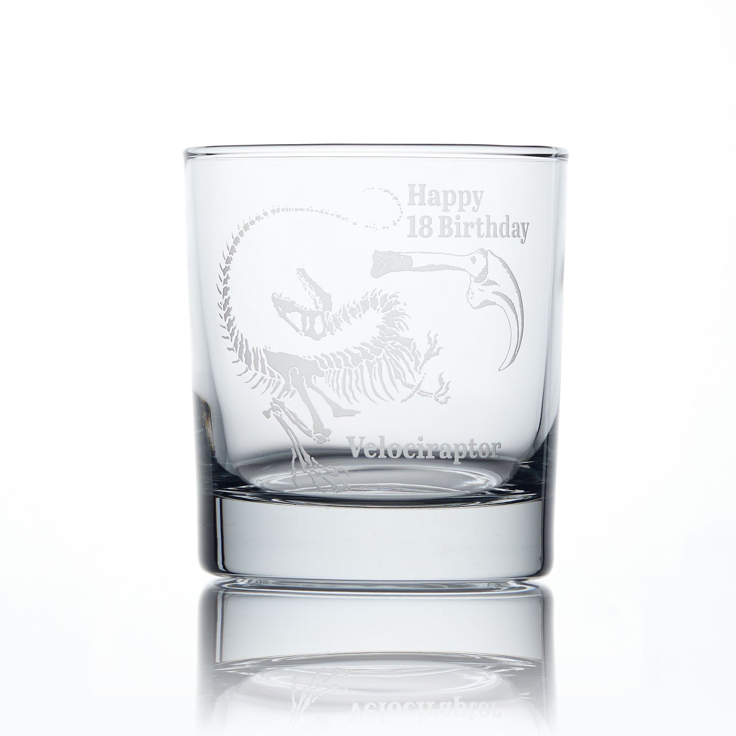 Personalised whisky glass engraved with a Velociraptor dinosaur fossil