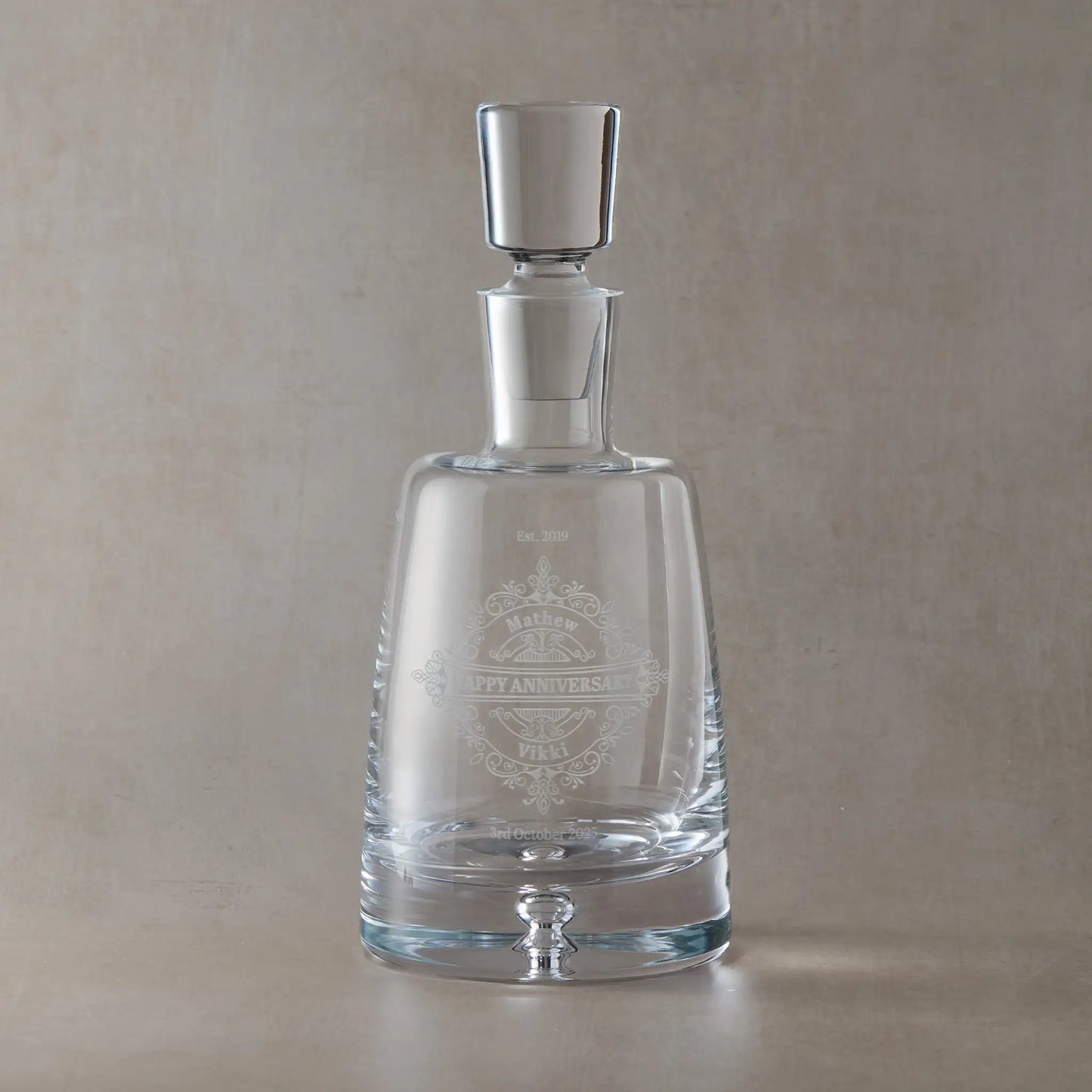 Handmade decanter engraved with Happy Aniversary, Names and date surrounded by a venetian lacework design.