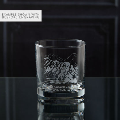 Personalised whisky glass engraved with the Aonach Eagach ridge, photographed on a black background