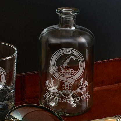 etched apothecary bottle engraved with scottish clan armstrong crest