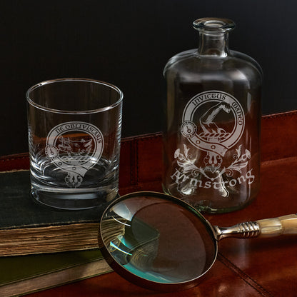 etched apothecary bottle and whisky glass engraved with scottish clan crest