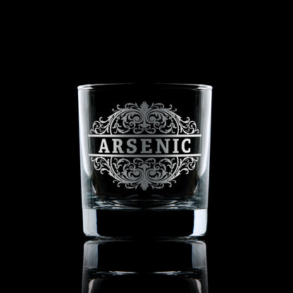 Arsenic poison-label engraved whisky glass shown on a dark background