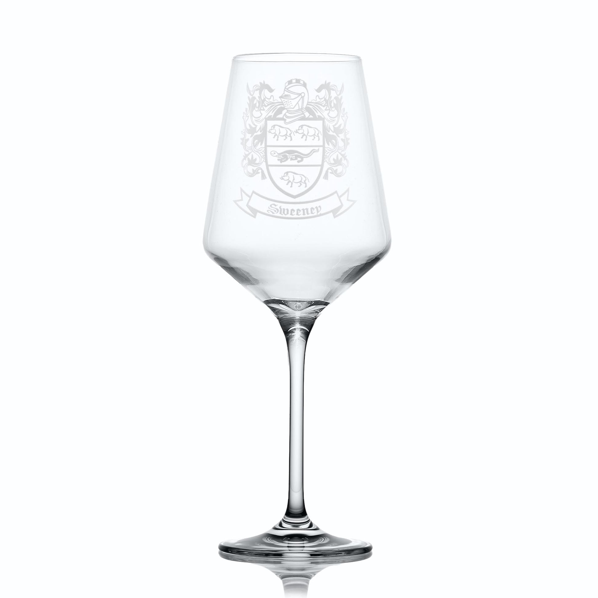 Clear wine glass with an engraved crest on a white background