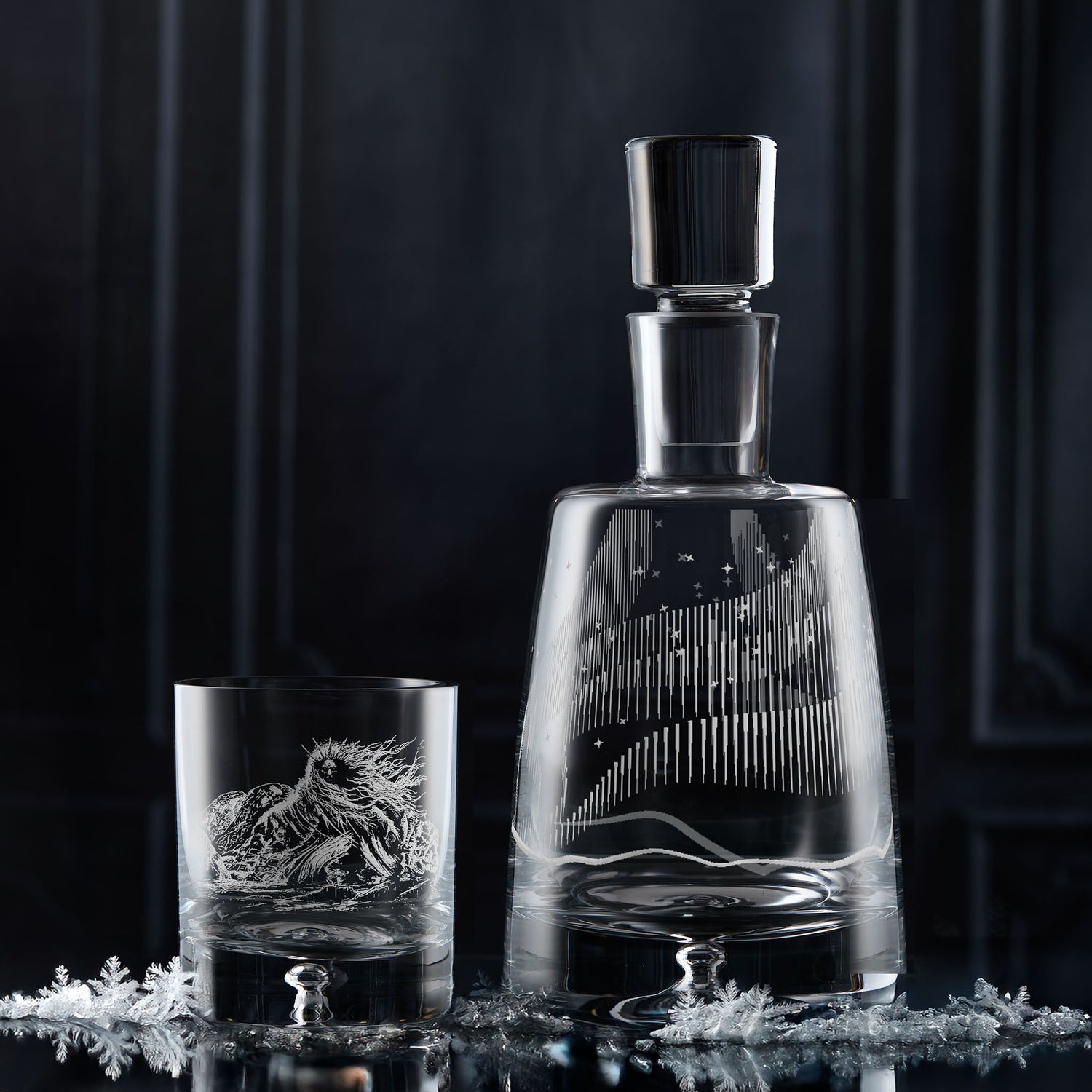 Aurora Borealis decanter and Cailleach Snow Queen whisky glass on a dark background.