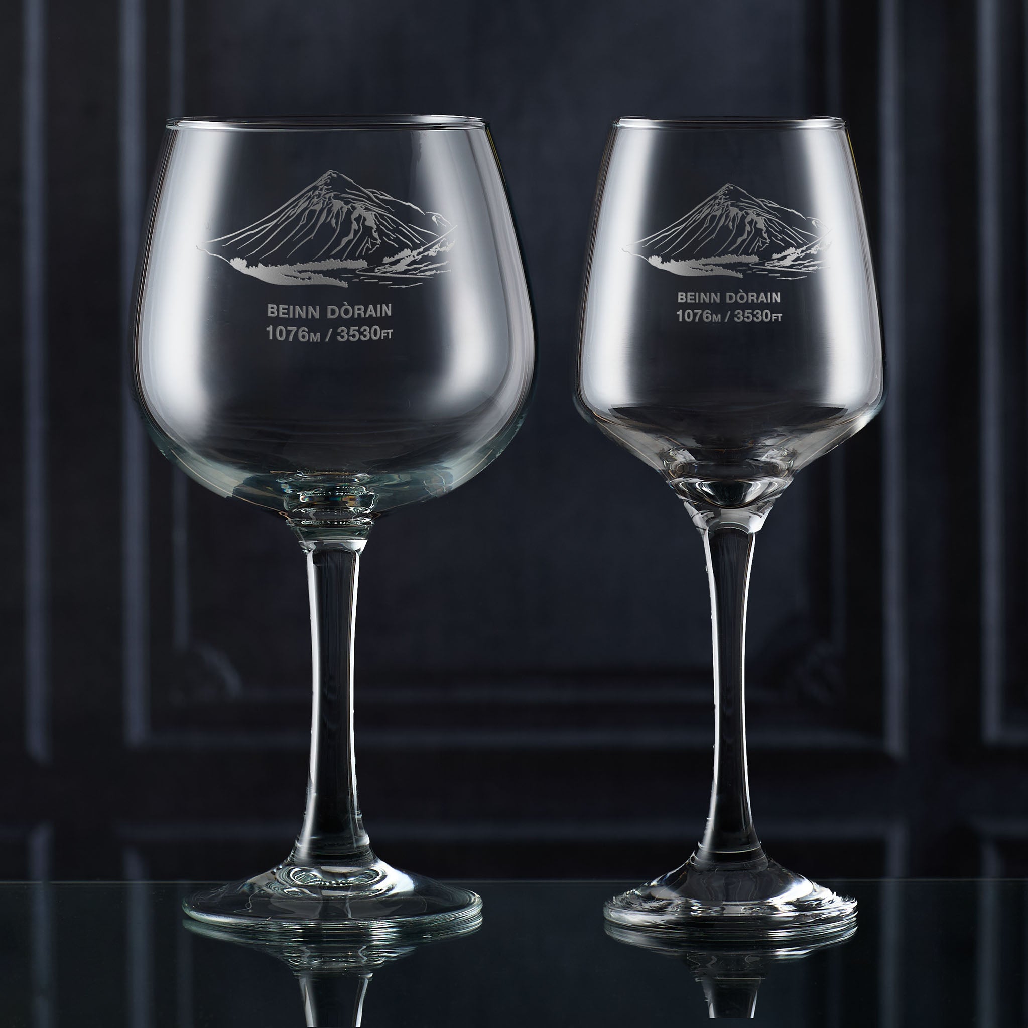 Pair of stemmed glasses engraved with the outline of Beinn Dorain.