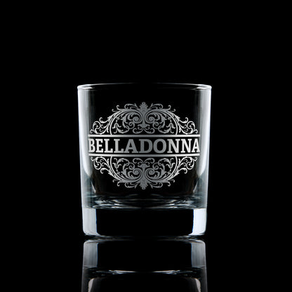 Belladonna engraved whisky glass photographed on a dark background