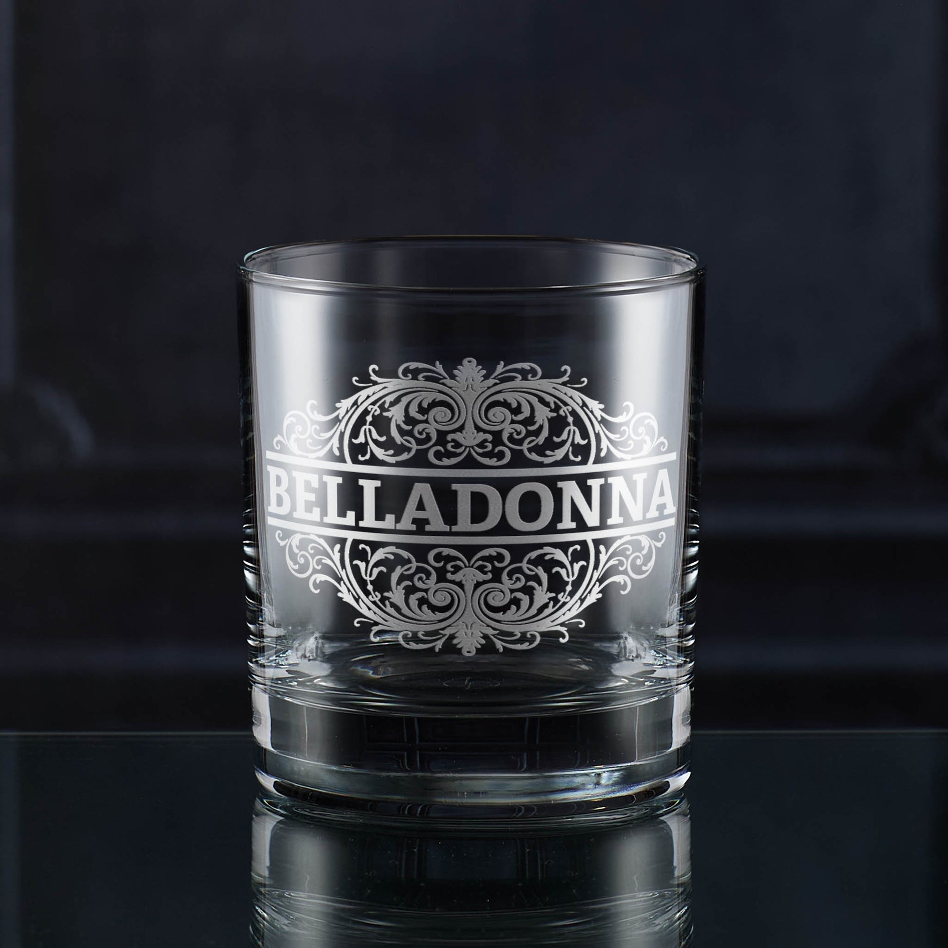 Whisky tumbler engraved with an ornate Belladonna poison label design.