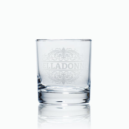 Belladonna engraved whisky glass photographed on a white background, highlighting glass clarity and intricate satin-etched typography