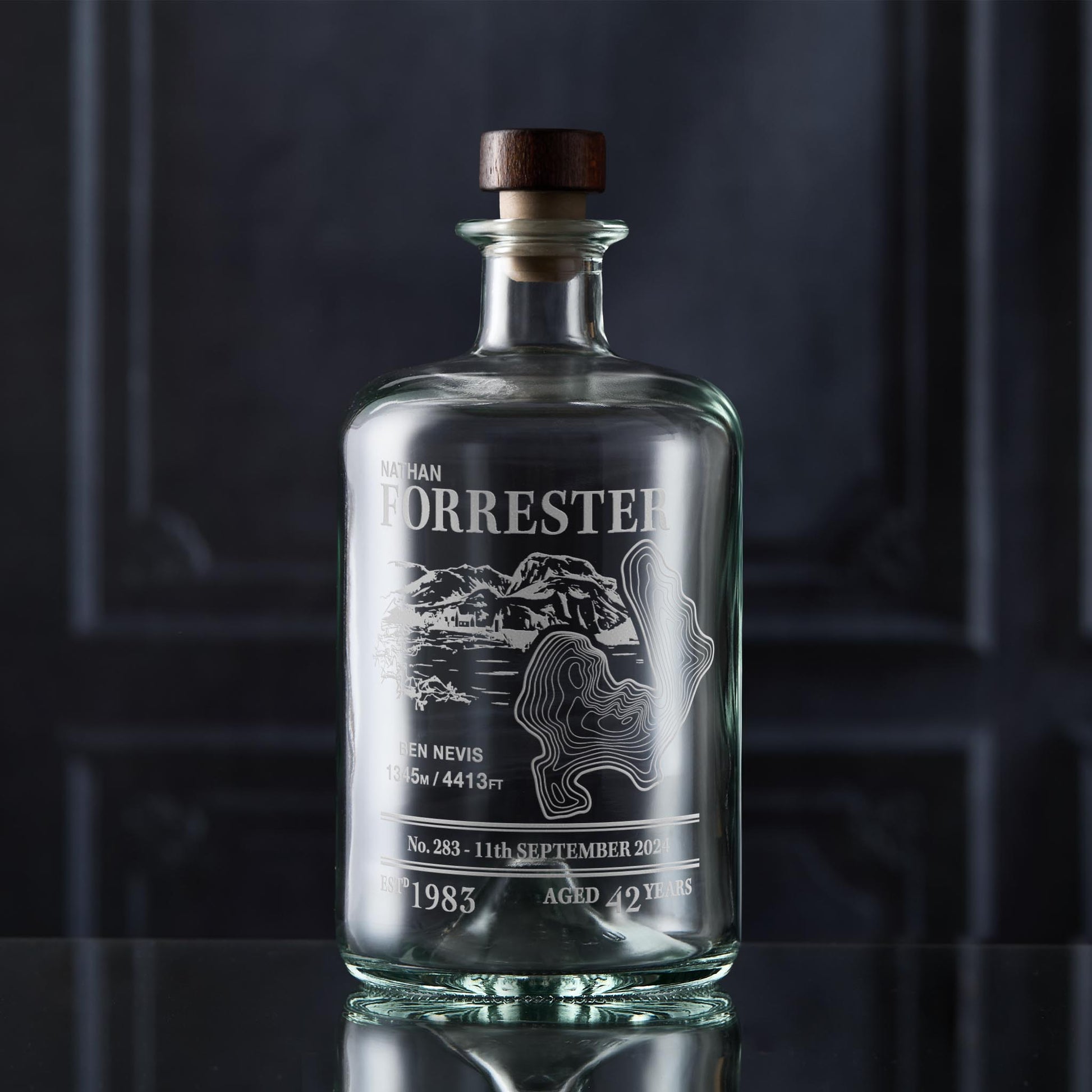 Apothecary-style decanter engraved with Ben Nevis, photographed in situ against a dark background