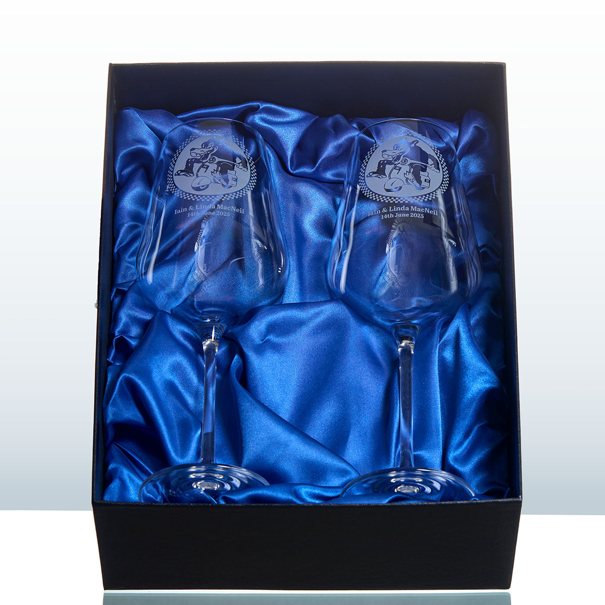 Two bespoke engraved scooterist wine glasses in a satin-lined presentation box, handcrafted for a wedding gift.