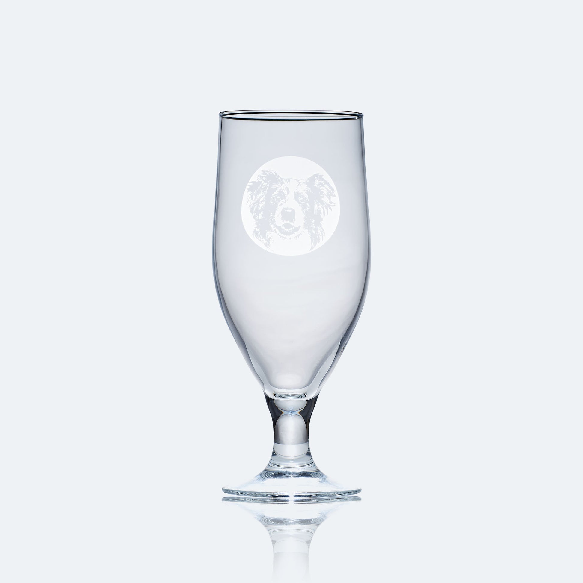 chalice beer glass engraved with a portrait of a border collie dog