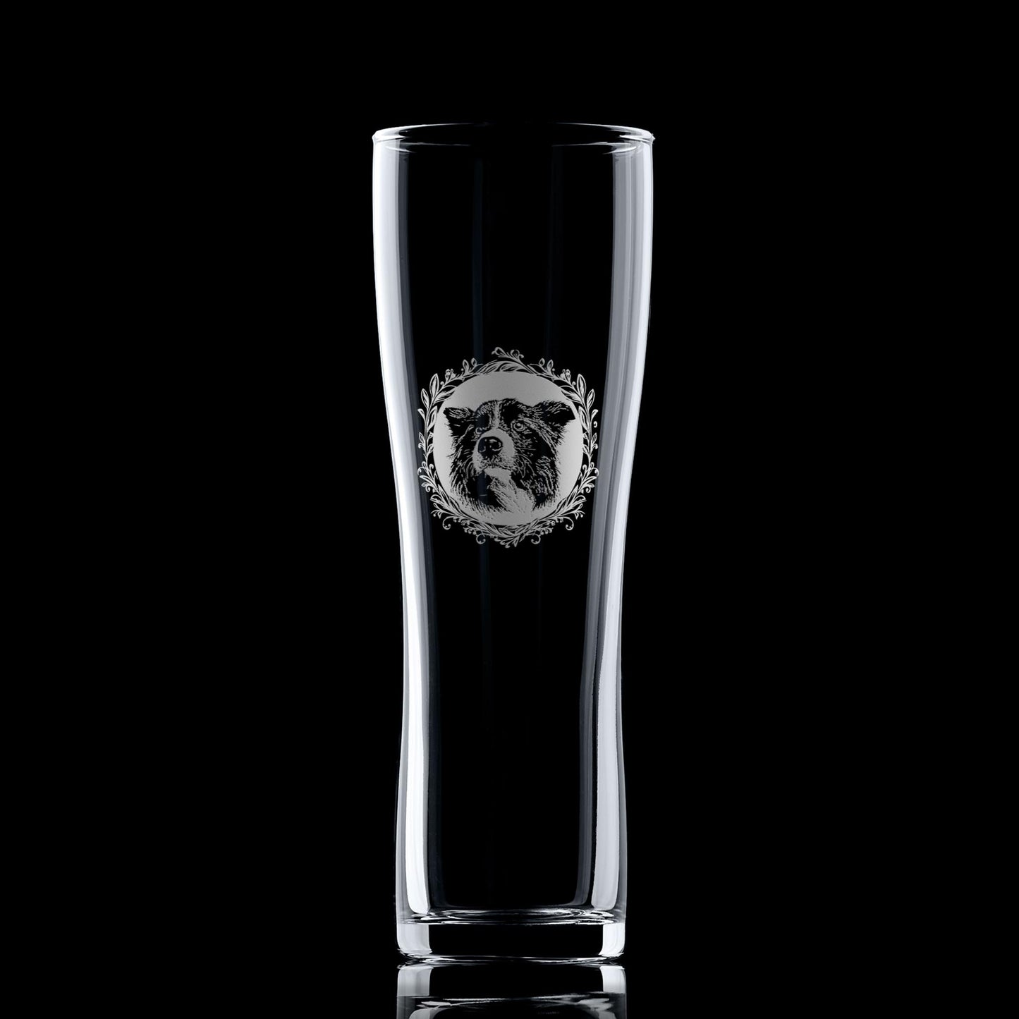 Pint glass with engraved Border Collie portrait in circular frame with leafy garland