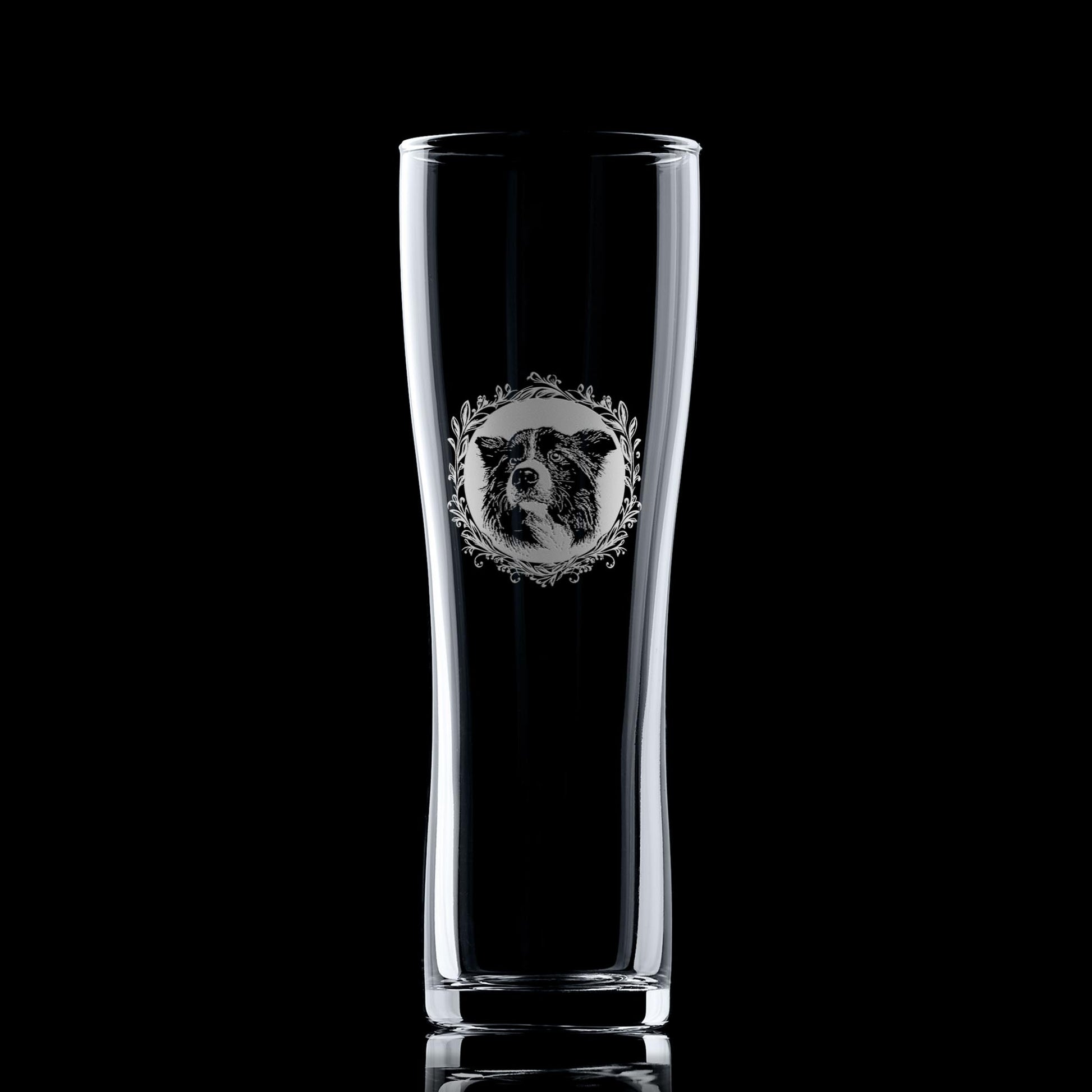Pint glass with engraved Border Collie portrait in circular frame with leafy garland