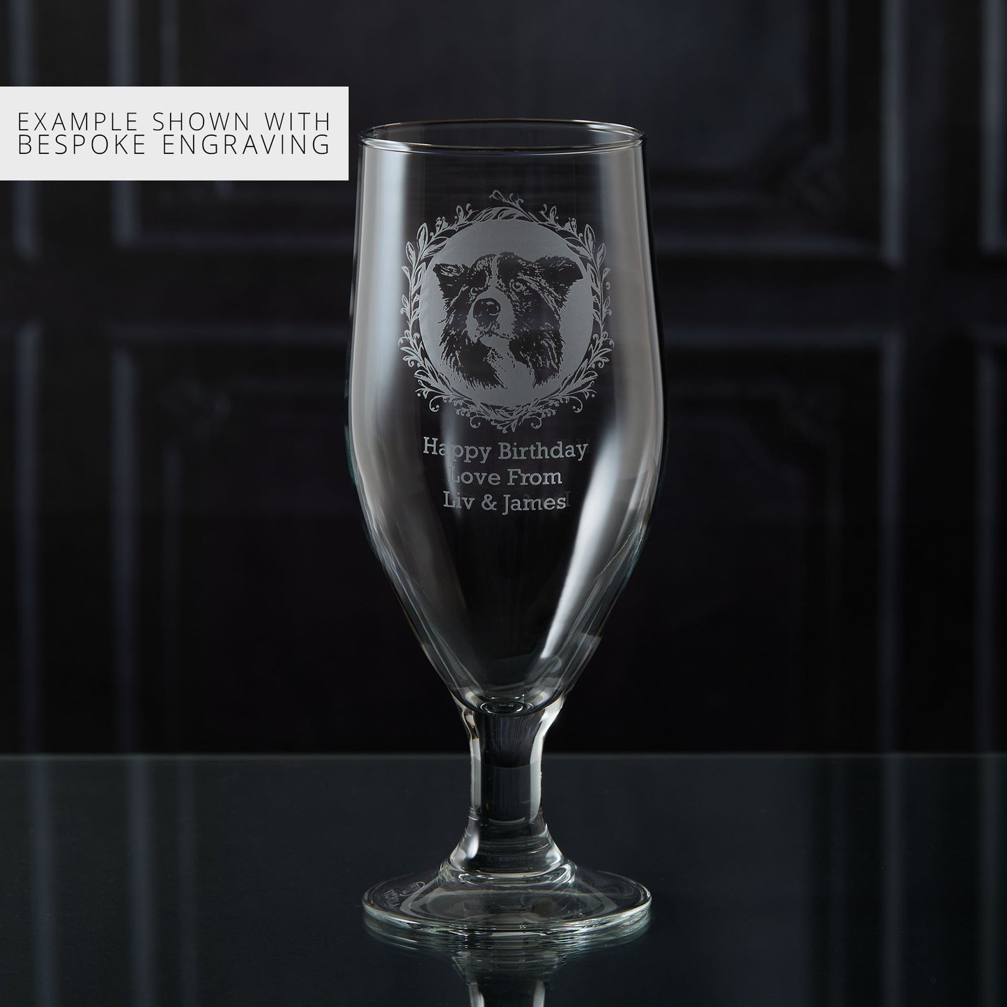Personalised stemmed beer glass with engraved sheepdog portrait and personalised text on a dark background