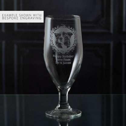Personalised stemmed beer glass with engraved sheepdog portrait and personalised text on a dark background