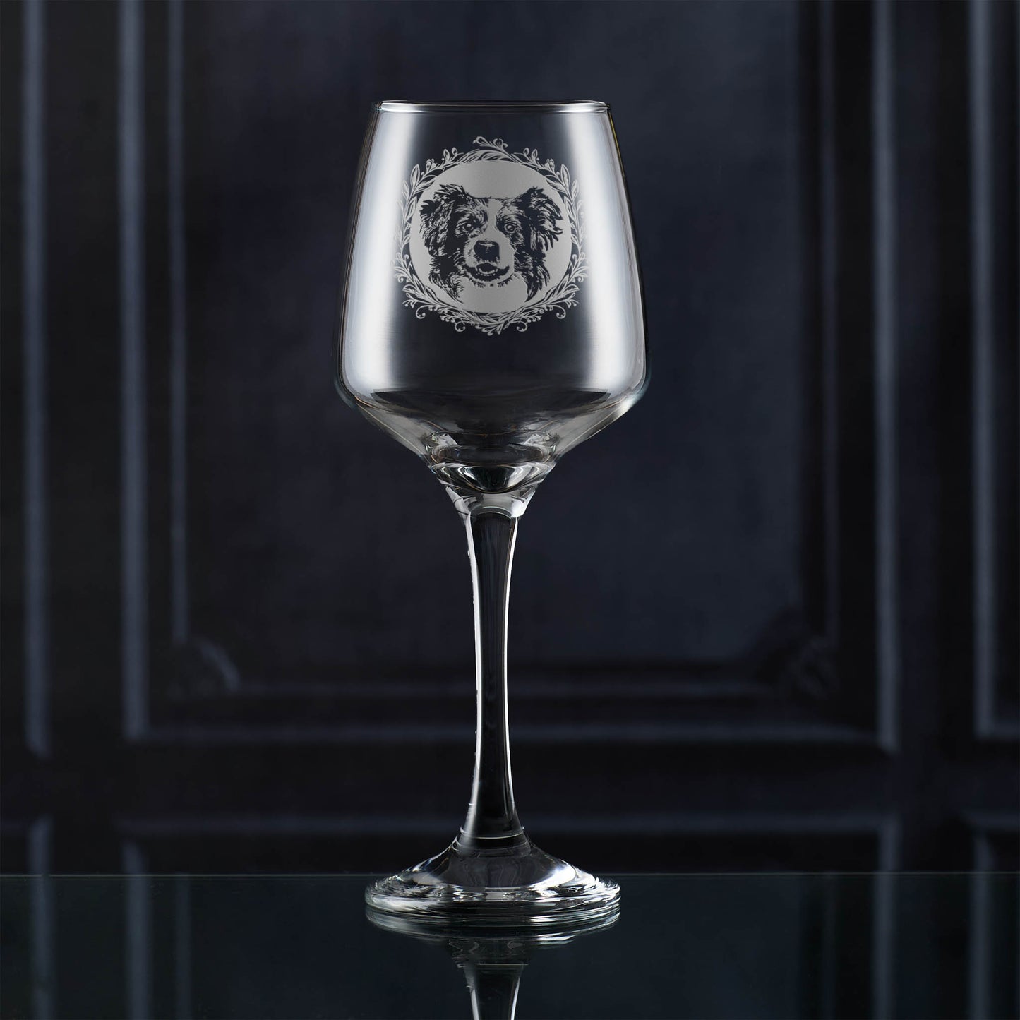 Wine glass with a dog illustration on a dark background