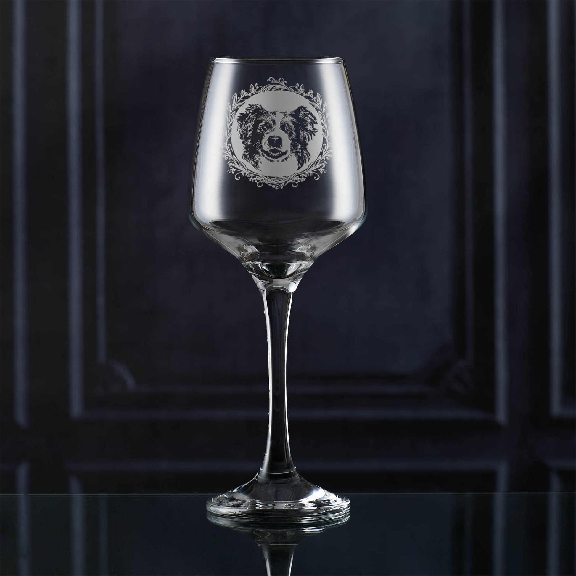 Wine glass with a dog illustration on a dark background