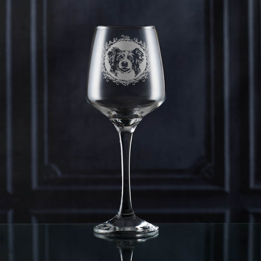 Wine glass with a dog illustration on a dark background