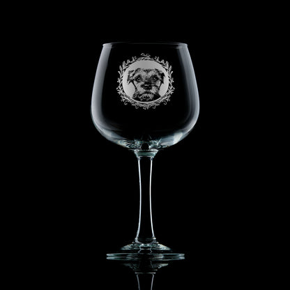 Gin glass with engraved border terrier portrait in circular frame with leafy garland