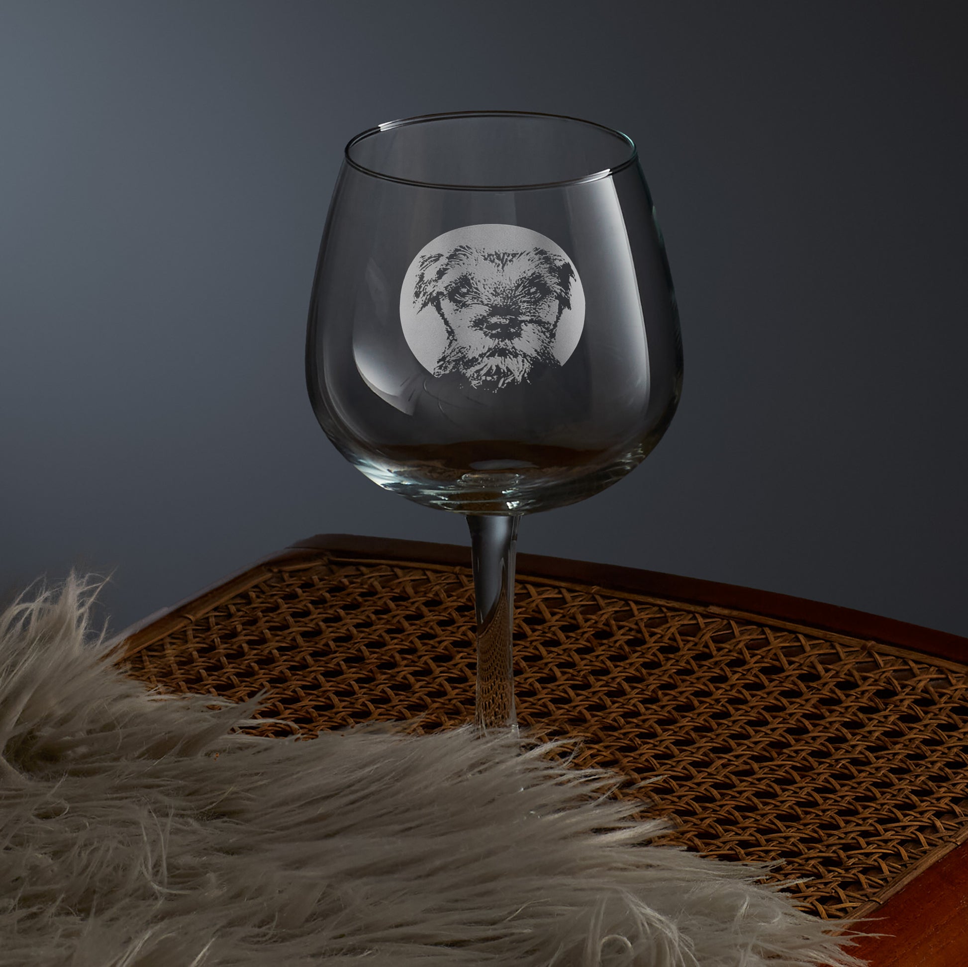 engraved gin glass with a portrait of a border terrier dog