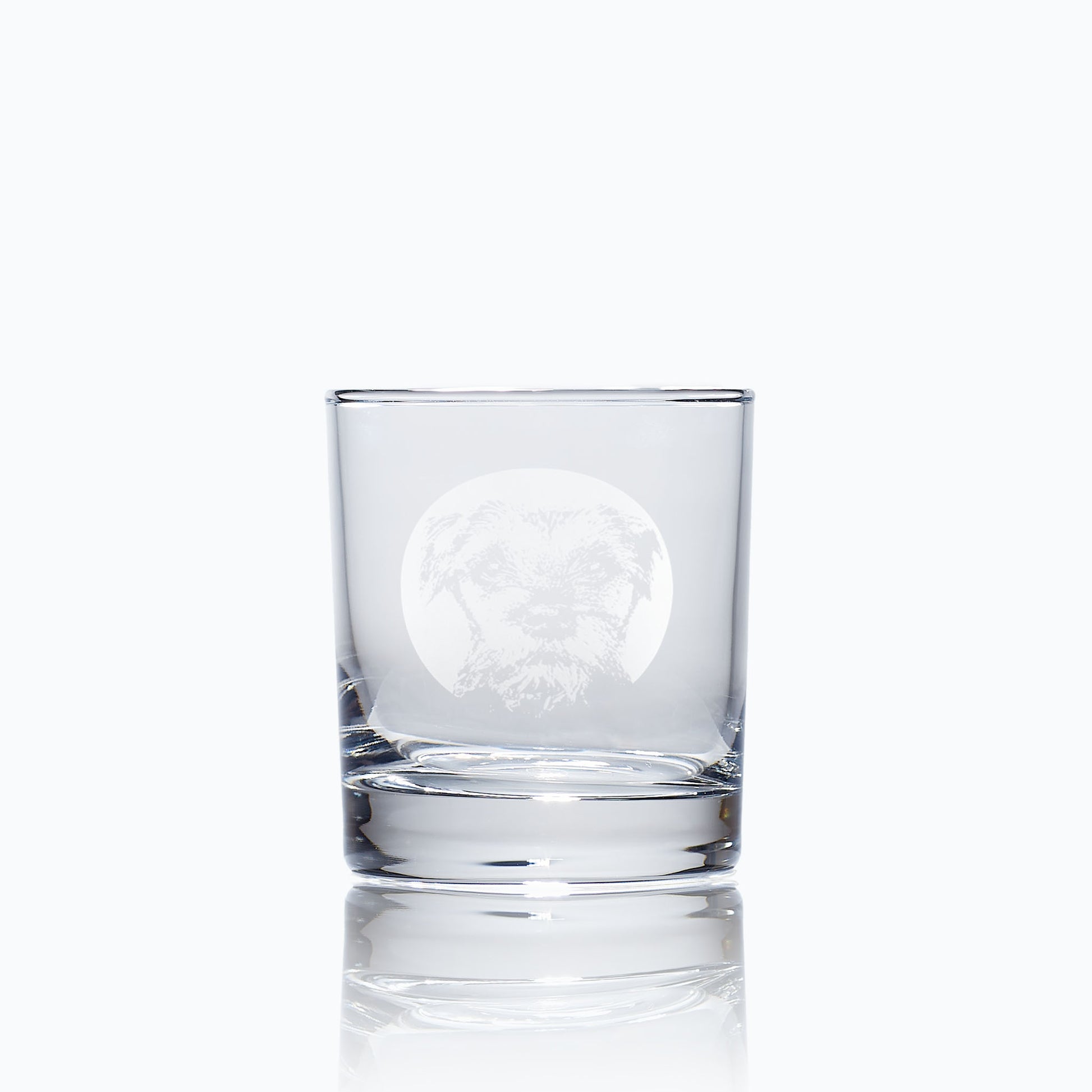 engraved whisky glass etched with a portrait of a border terrier dog