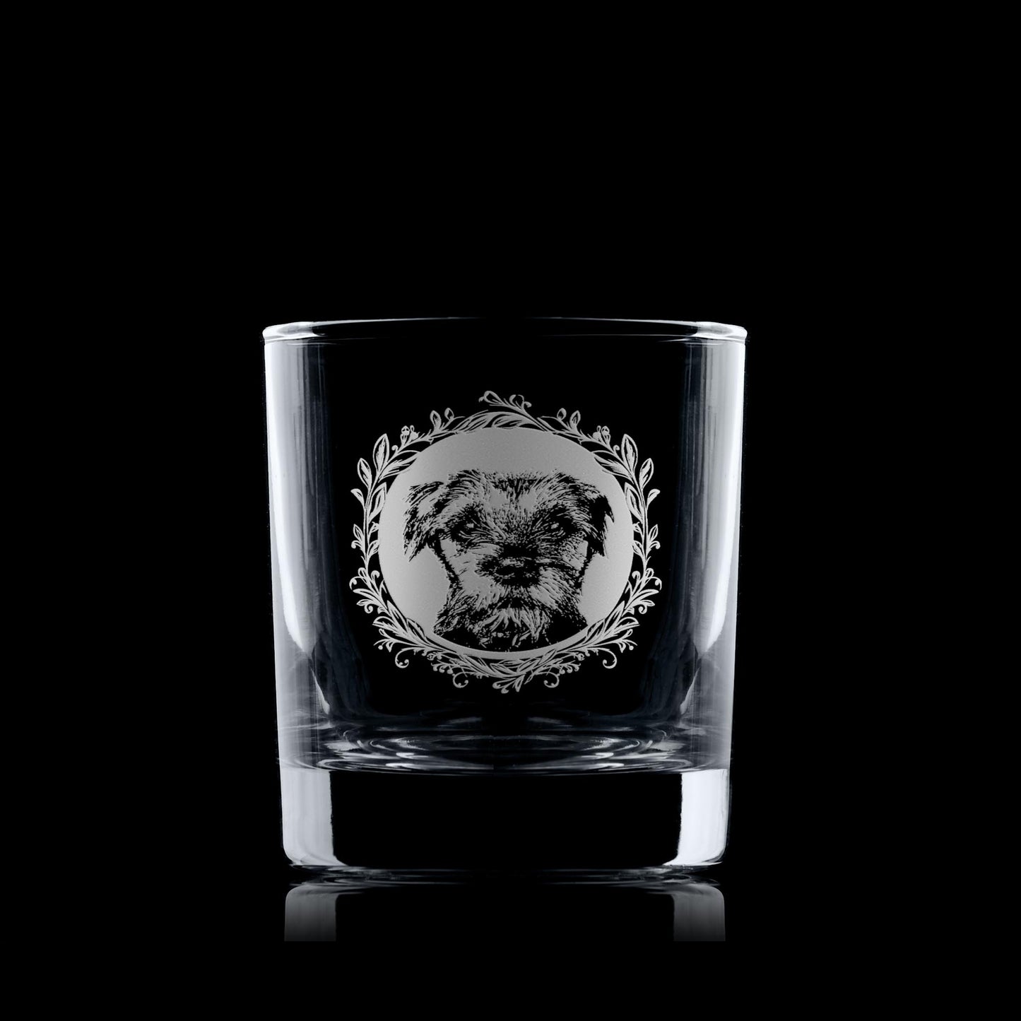 Whisky glass with engraved border terrier portrait in circular frame with leafy garland