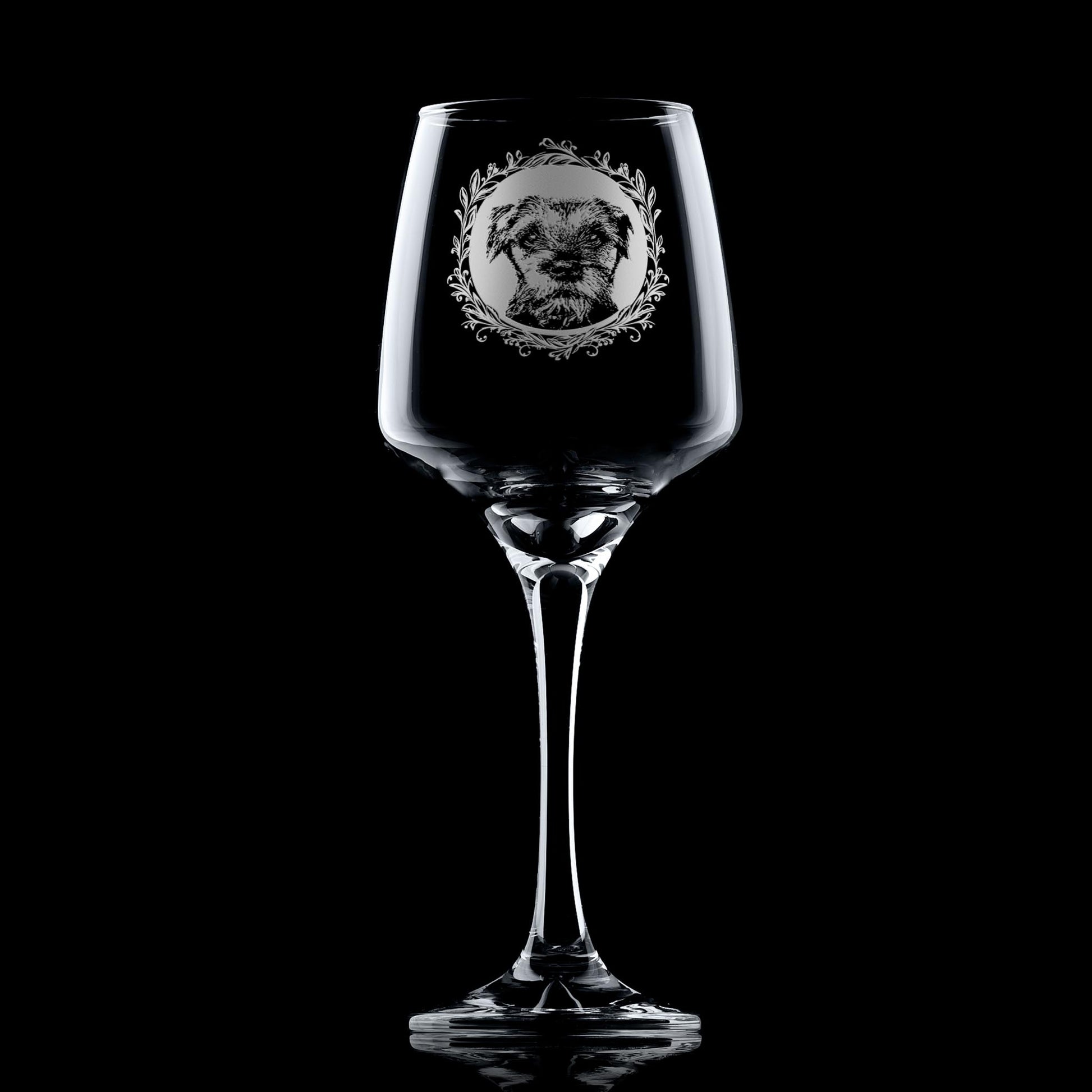 Wine glass with engraved border terrier portrait in circular frame with leafy garland