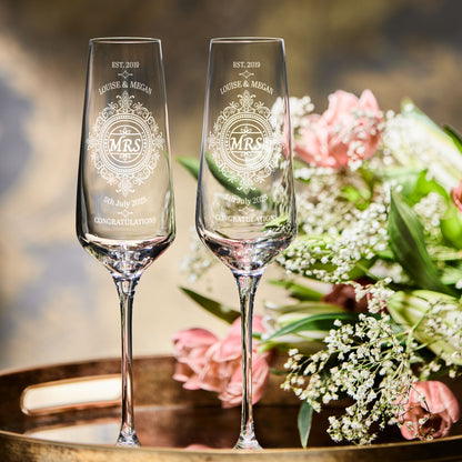 Pair of brides champagne flutes with personalised titles, names and wedding date